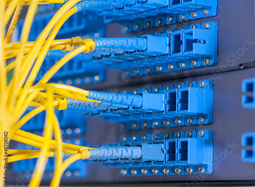 Photo: fiber optical network cables patch panel and switch fiber optical network cables patch panel and switch
