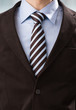 Closeup of torso of confident business man wearing elegant suit