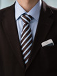 Closeup of torso of confident business man wearing elegant suit