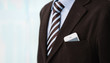 Closeup of torso of confident business man wearing elegant suit