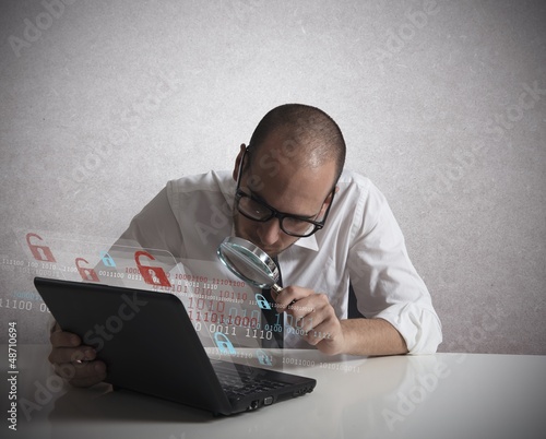 Photo: Hacker analyzing software Hacker analyzing software