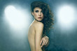 Foto : Fashion photo of sensual brunette woman with shiny curly hair Fashion photo of sensual brunette woman with shiny curly hair