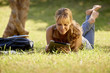 Photo: Woman with books and tablet pc studying for college test Woman with books and tablet pc studying for college test