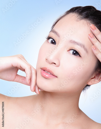 Photo: woman finger touch her perfect skin woman finger touch her perfect skin