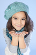 Little girl holding snow