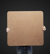 man holding blank poster