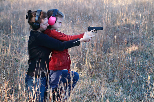 Photo: Mom and Daughter Practicing Shooting Mom and Daughter Practicing Shooting