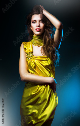 Photo: sensual sexy woman in green dress and blue light sensual sexy woman in green dress and blue light