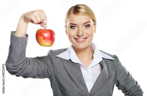 Photo: Businesswoman with red apple in her hand - healthy eating concep Businesswoman with red apple in her hand - healthy eating concep