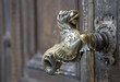Photo: Old golden door handle unique on a wooden door Old golden door handle unique on a wooden door