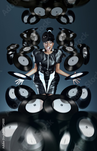Photo: Futuristic african woman screaming with vinyl records Futuristic african woman screaming with vinyl records