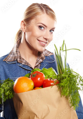 Photo: Young woman with a grocery shopping bag. Isolated on white backg Young woman with a grocery shopping bag. Isolated on white backg