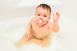 Lovely baby boy taking in bath