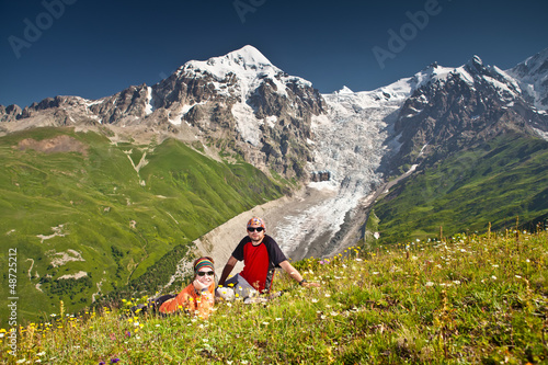 Photo: Hiker take a rest during hiking in Caucasus mountains, Georgia Hiker take a rest during hiking in Caucasus mountains, Georgia