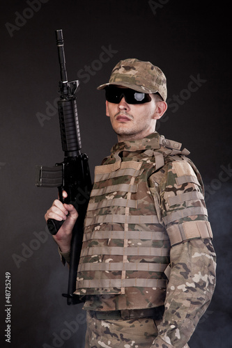 Photo: Modern soldier with rifle Modern soldier with rifle