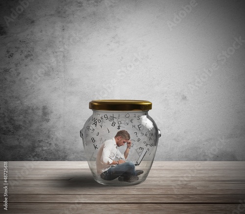 Photo: Businessman trapped by work Businessman trapped by work