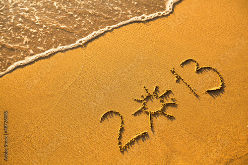 Photo: 2013 written in sand on beach texture (soft wave of the sea) 2013 written in sand on beach texture (soft wave of the sea)