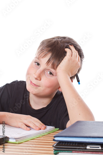 Photo: schoolchild learns lessons schoolchild learns lessons