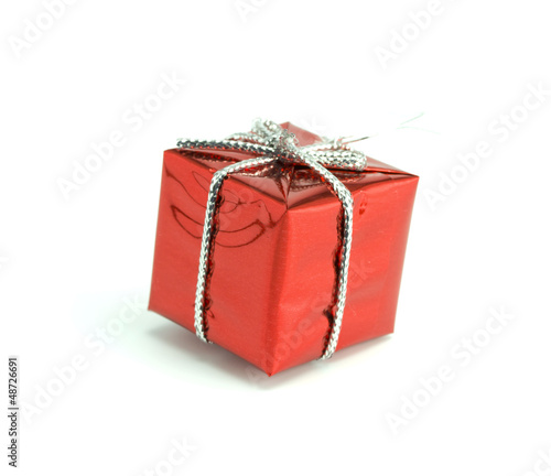 Photo: Red gift tied up by a ribbon Red gift tied up by a ribbon