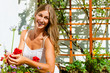 Woman gardener looking after flowers