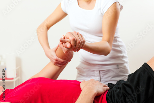 Photo: Patient at the physiotherapy doing physical therapy Patient at the physiotherapy doing physical therapy