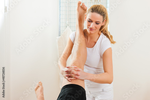 Photo: Patient at the physiotherapy doing physical therapy Patient at the physiotherapy doing physical therapy