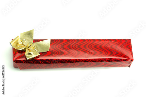 Photo: Red gift with a gold bow Red gift with a gold bow