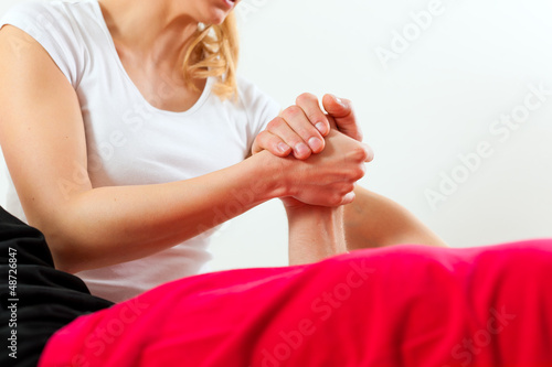 Photo: Patient at the physiotherapy doing physical therapy Patient at the physiotherapy doing physical therapy