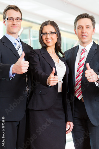 Photo: Business - group of businesspeople in office Business - group of businesspeople in office