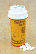 pill bottle with money