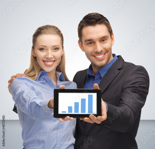 Photo: man and woman with tablet pc man and woman with tablet pc