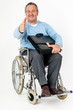 Friendly man in wheelchair holding thumbs up