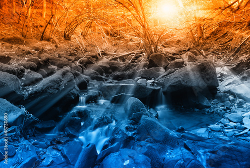 Photo: sunbeam at sunset over the river in the forest sunbeam at sunset over the river in the forest