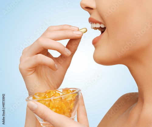 Photo: woman with vitamins woman with vitamins