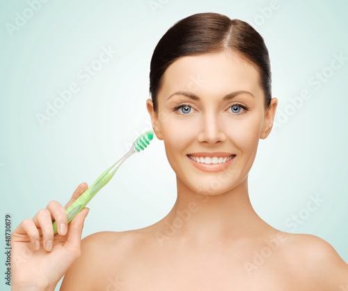 Photo: woman with toothbrush woman with toothbrush