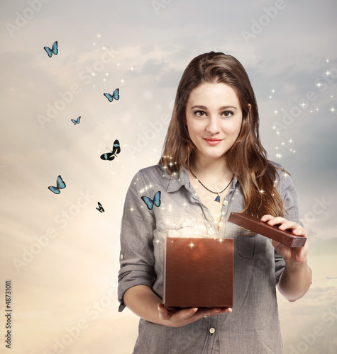 Photo: Girl Opening a Magical Present Girl Opening a Magical Present