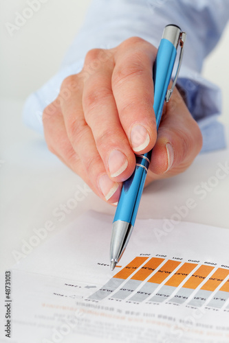 Photo: Hand holding pen Hand holding pen