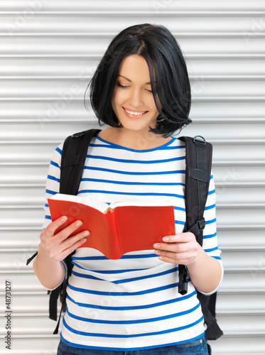 Photo: woman with bag and book woman with bag and book