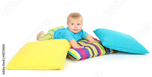 Photo: Little boy and color pillows, isolated on white Little boy and color pillows, isolated on white