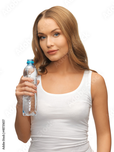 Photo: young beautiful woman with bottle of water young beautiful woman with bottle of water