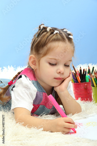 Photo: cute little girl playing with multicolor pencils, cute little girl playing with multicolor pencils,