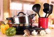 Photo: composition of kitchen tools and vegetables on table in kitchen composition of kitchen tools and vegetables on table in kitchen