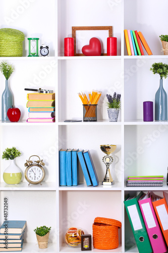 Photo: Beautiful white shelves with different home related objects Beautiful white shelves with different home related objects