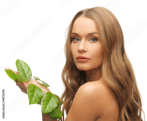 Photo: woman with green leaf woman with green leaf