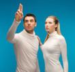 Photo: man and woman working with something imaginary man and woman working with something imaginary