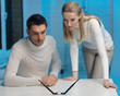 man and woman working with something