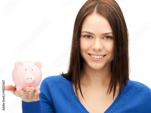 Photo: lovely woman with piggy bank lovely woman with piggy bank