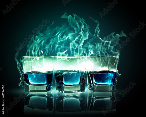 Photo: Three glasses of burning emerald absinthe Three glasses of burning emerald absinthe