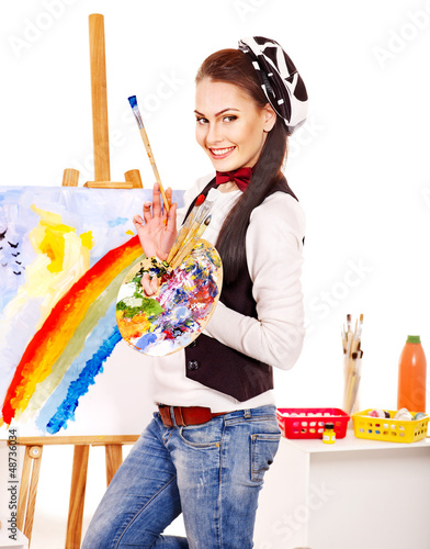Photo: Female artist at work. Female artist at work.