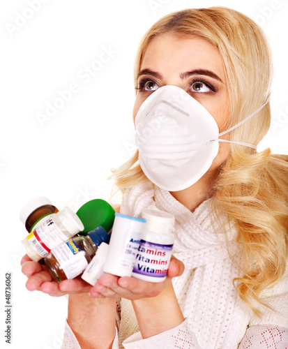 Photo: Young woman having flu takes pills. Young woman having flu takes pills.